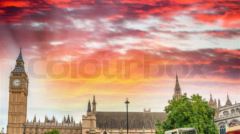 Sunset view of Big Ben and Westminster Palace with city traffic, London - UK, stock photo