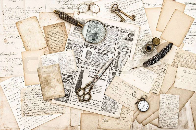 Antique office accessories, old letters and postcards, old ink pen. Nostalgic paper background. Vintage style toned picture, stock photo