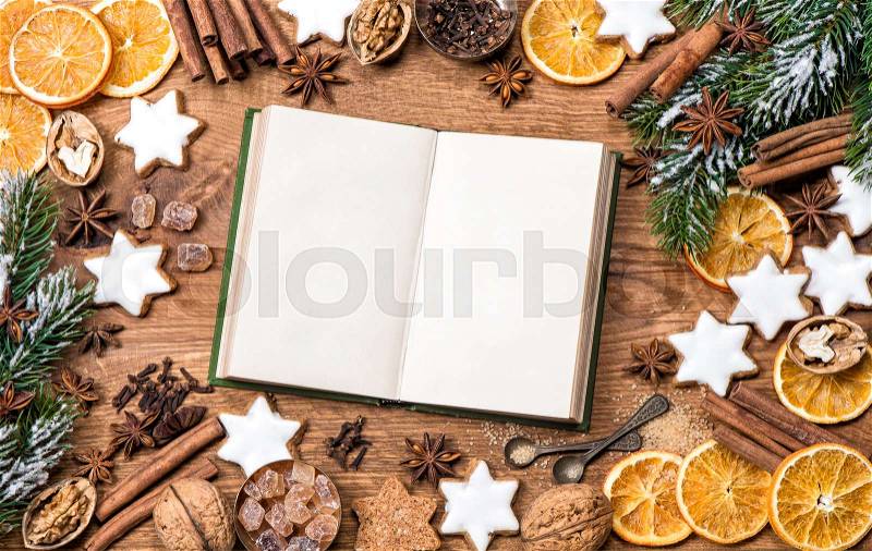 Christmas cookies, spices and recipe book. Food background. Vintage style picture, stock photo