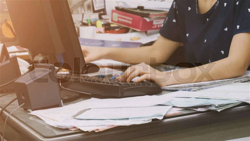 Close-up of women dressed casual using computer office, stock photo