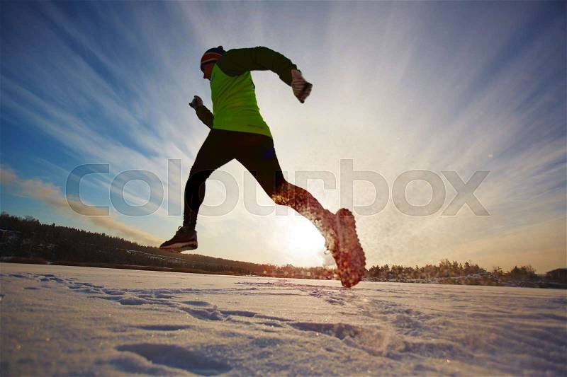 Young man starting his day with running, stock photo