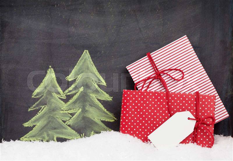 Christmas gift boxes and hand drawn xmas fir tree with snow, stock photo