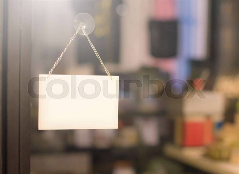 Empty sign hanging on a window in a shop showroom , stock photo