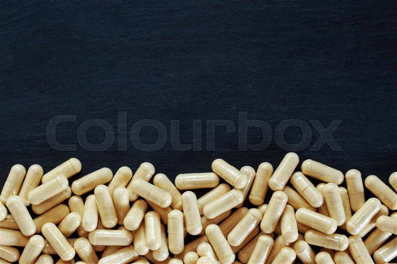 The medical pills on a black background, stock photo