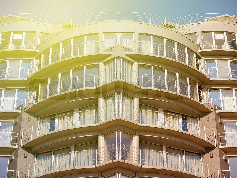Modern, large apartment building on sunny day, stock photo