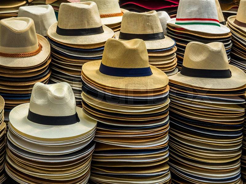 Sun hats for men in a market in rome, italy, stock photo