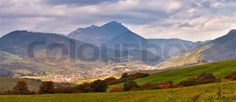 Slovakia autumn sunny morning panorama. Rural fall mountain scene. Village in valley, stock photo