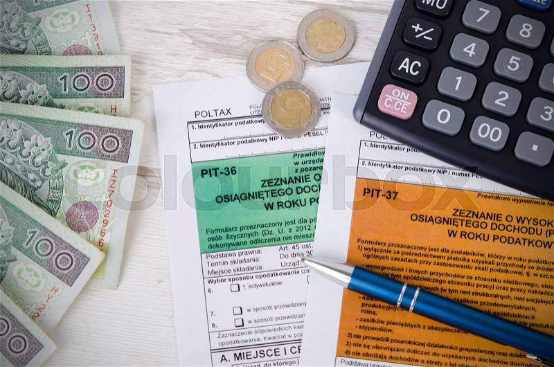 Polish tax form with cash and calculator. Accounting pit business polish zloty concept, stock photo
