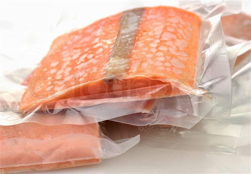 Frozen salmon fillets in a vacuum package, stock photo