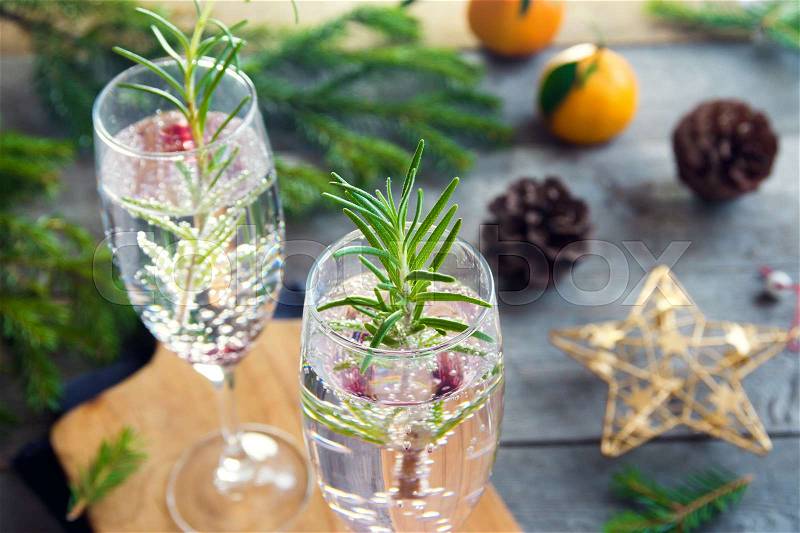 Mimosa festive drink for Christmas - champagne cocktail with rosemary for Christmas party, stock photo