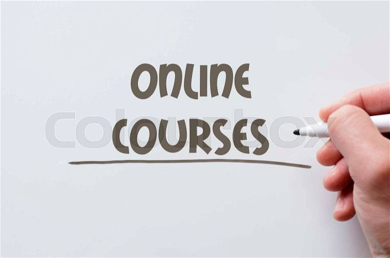 Human hand writing online courses on whiteboard, stock photo