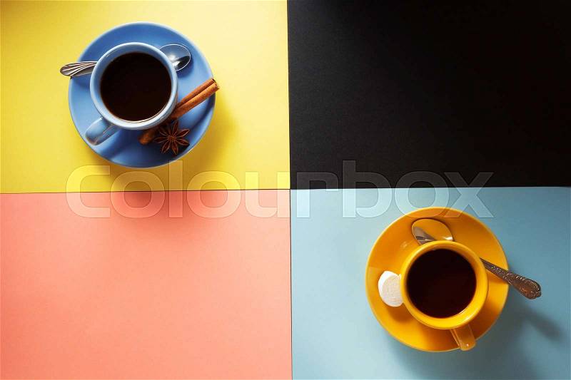 Cup of coffee and cacao at colorful background, stock photo