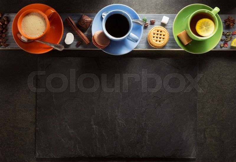 Cup of coffee and tea on wooden background, stock photo