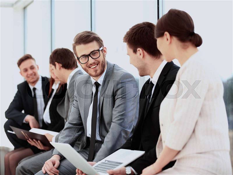 Business Team Having Informal Meeting In Office, stock photo