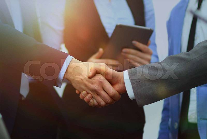 Business handshake in office, stock photo