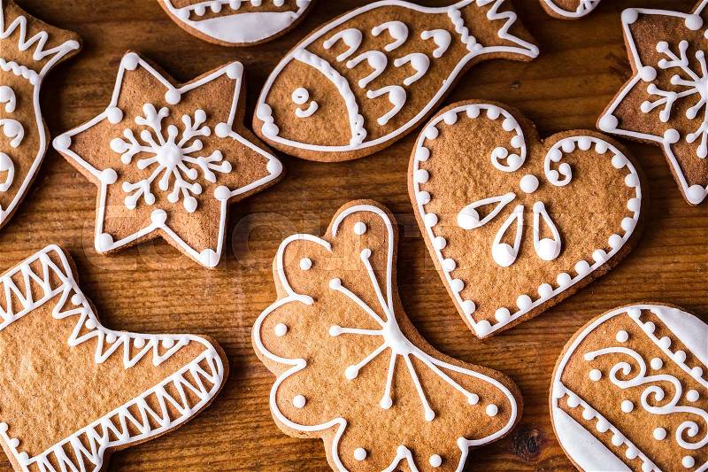 Christmas sweet cakes. Christmas homemade gingerbread cookies on wooden table, stock photo