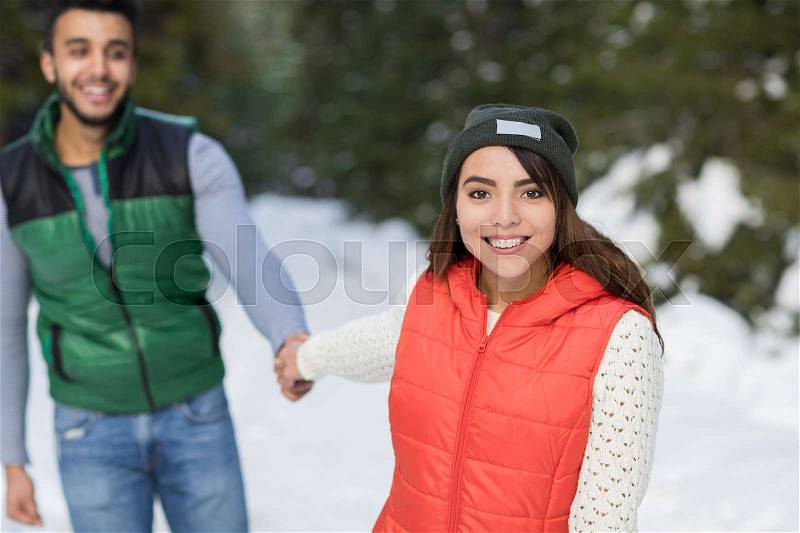 Young Mix Race Couple Snow Forest Outdoor Winter Walk Pine Woods, stock photo