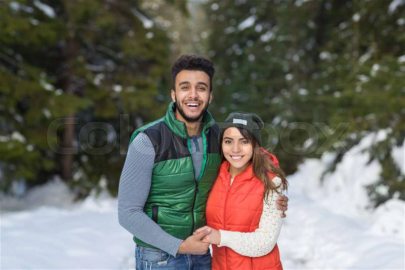 Young Mix Race Couple Snow Forest Outdoor Winter Walk Pine Woods, stock photo