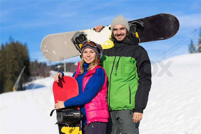 Couple With Snowboard Ski Resort Snow Winter Mountain Smiling Man And Woman Extreme Sport Vacation Holiday, stock photo