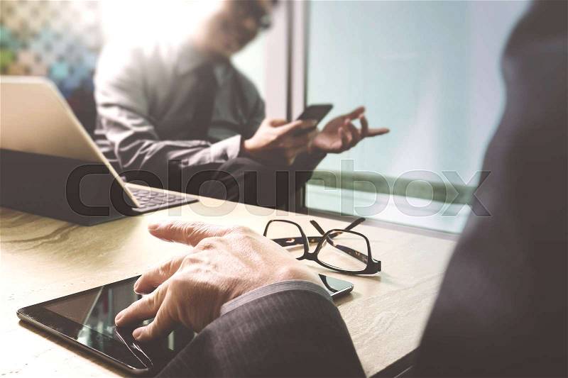 Business team meeting present. professional investor working new startup project. Finance managers meeting.Digital tablet keyboard docking screen computer design smart phone using, sun effect, stock photo