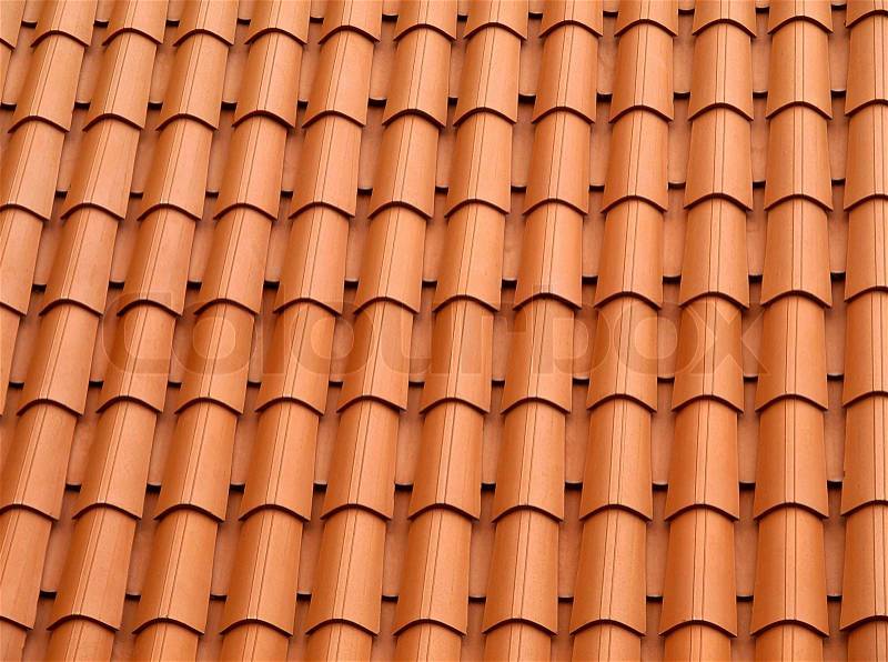 Traditional orange clay roofing tiles, stock photo
