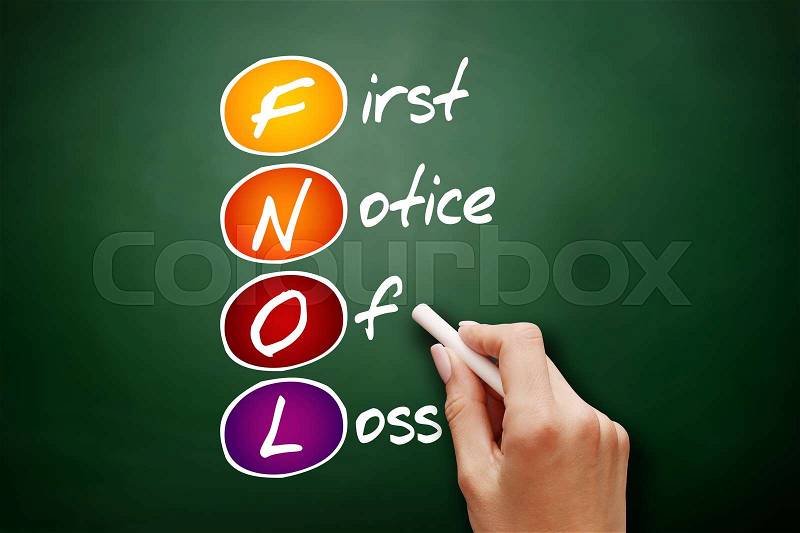 Hand drawn FNOL - First Notice Of Loss, acronym concept on blackboard, stock photo