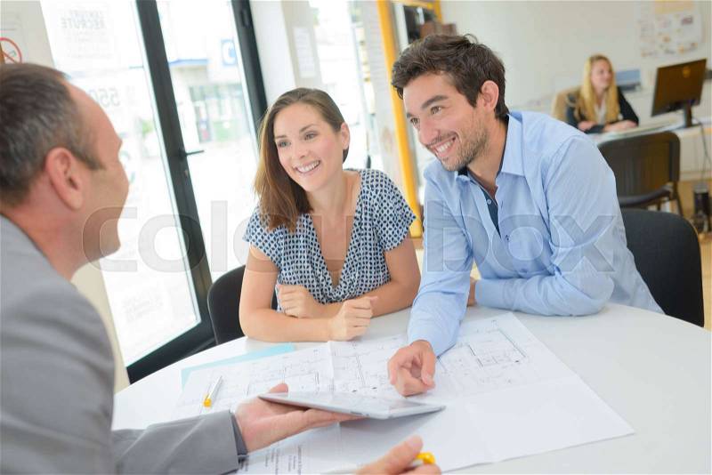 Discussing the house plan, stock photo