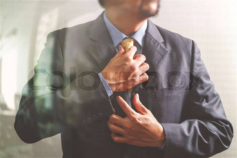 Businessman adjusting tie,Front view, no head. Concept of working in an office.filter effect, stock photo