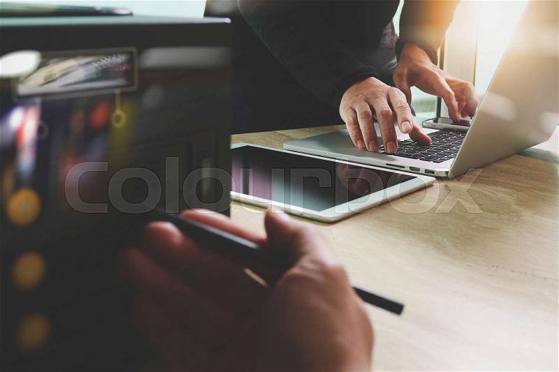 Business team meeting present. Photo professional investor working with new startup project. Finance managers meeting.Digital tablet laptop computer design smart phone using, compact server foreground, stock photo