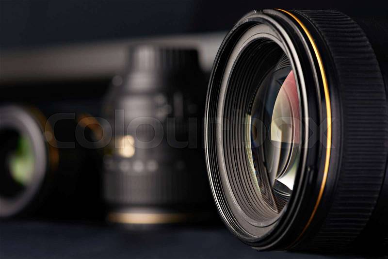 Photo lens side view on blurred object background, stock photo
