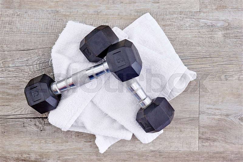 A studio photo of a black gym dumbbell, stock photo