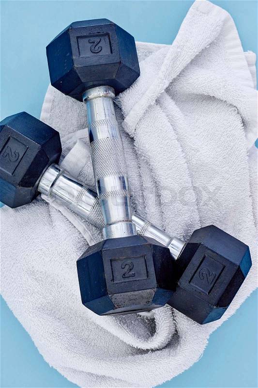 A studio photo of a black gym dumbbell, stock photo