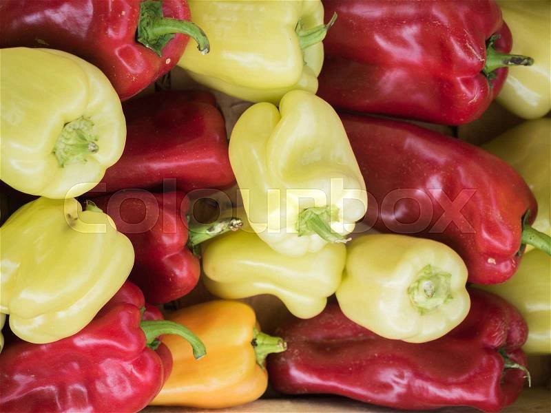 Background of a stacked red, green and yellow peppers, Large, sweet, red pepper, stock photo