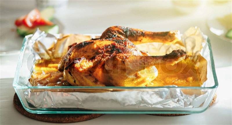 Delicious Roast chicken on table made under special Swedish recipe with ginger, oranges, apples and other organic food ingredients - ready to be served, stock photo