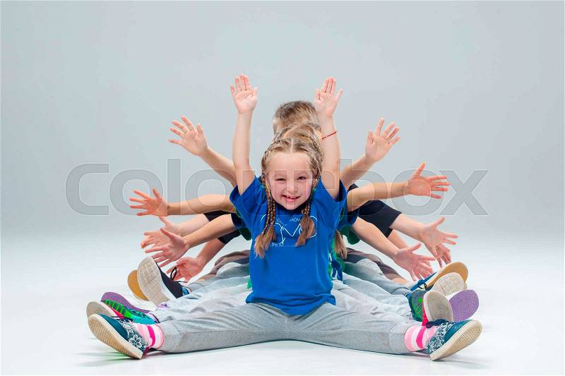 The kids dance school, ballet, hiphop, street, funky and modern dancers on gray studio background, stock photo