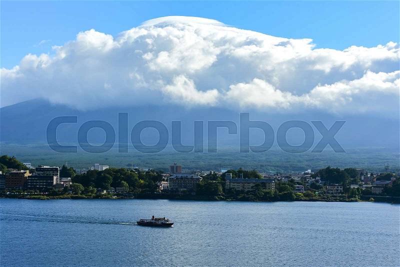 Landscape at kawaguchiko lake of Japan with big cloud covered Fuji Mountain, stock photo