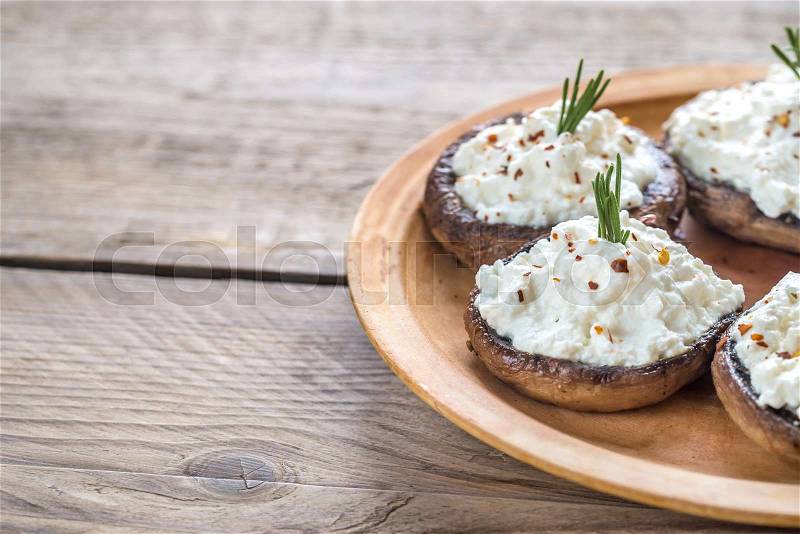 Baked mushrooms stuffed with cream cheese, stock photo