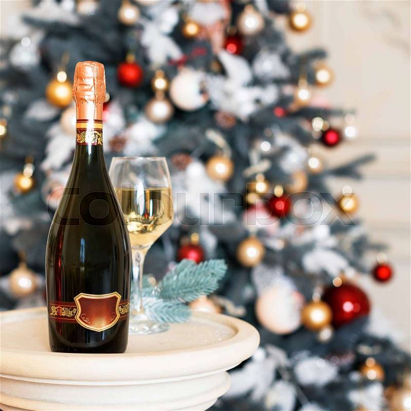 Wine in Christmas setting. New Year decorations. Winter holidays theme, stock photo