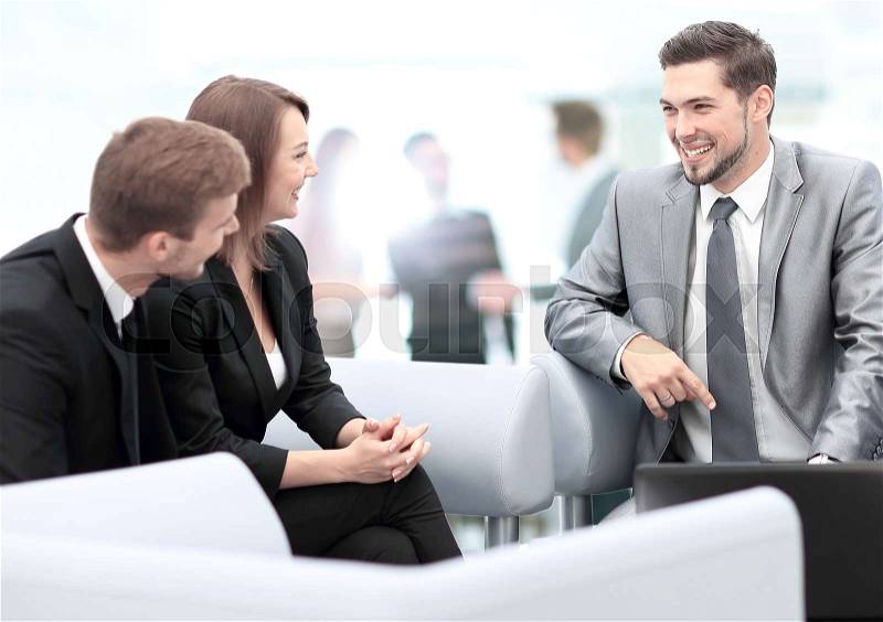 Happy business people talking on meeting at office, stock photo