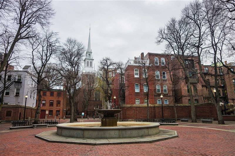 Boston, USA - April 28, 2015: Old North Church and fountain in downtown Boston, Massachusetts, the United States. People on the background, stock photo