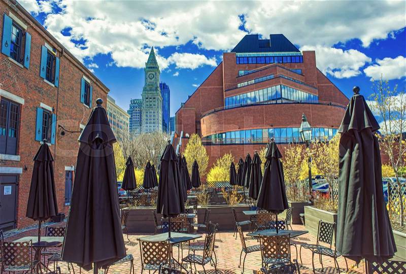 Custom House Tower and street cafe with umbrellas at Long Wharf in Boston, Massachusetts, the United States, stock photo