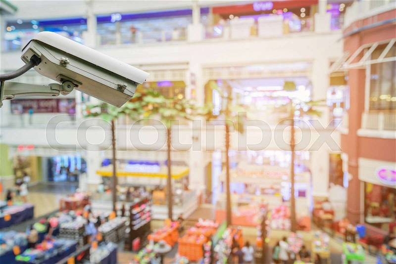 Closed Circuit Television camera monitoring of supermarket shopping mall, stock photo