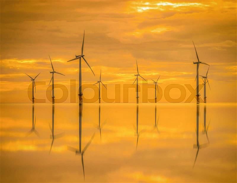 Sunset Offshore Wind Turbine in a Wind farm under construction off the England coast, stock photo