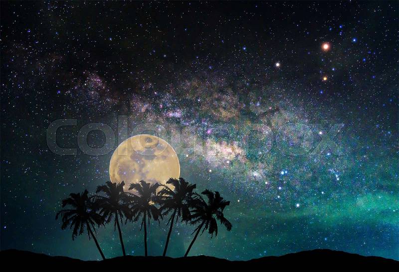 Landscape with Milky way galaxy. Night sky with the moon and silhouette coconut plam tree on the mountain. Long exposure photograph. (Elements of this moon image furnished by NASA), stock photo