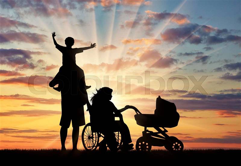 Disabled woman in wheelchair holding baby carriage and beside her husband holding baby on shoulders on sunset. Concept disabled and family, stock photo