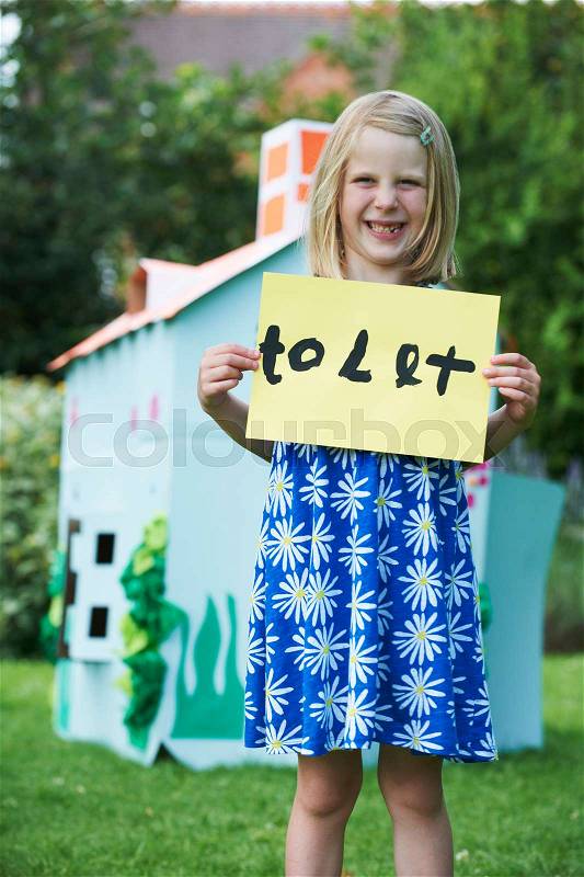 Little Girl Holding To Let Sign Outside Play House, stock photo