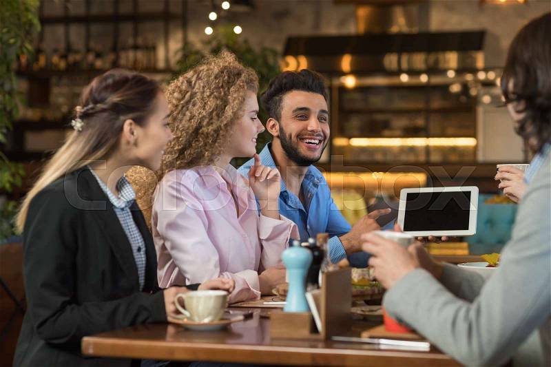 Young Business People Group Drink Coffee Cafe, Guy Show Tablet Computer, Friends Smiling Mix Race Men Women Talking, stock photo