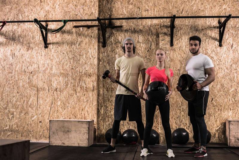 Sport Fitness People Group Crossfit Training Equipment, Young Healthy Man And Woman Gym Interior Doing Exercises, Full Length Portrait, stock photo