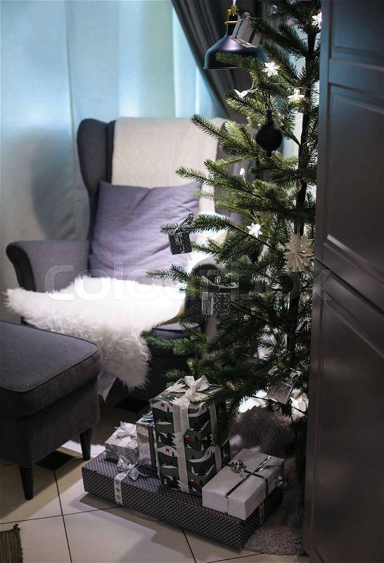 Christmas tree and a soft Chair in the room, stock photo