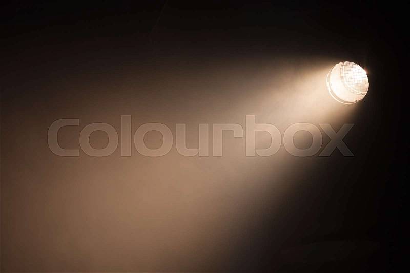 Ray of scenic spot light over dark background, stage illumination equipment, stock photo